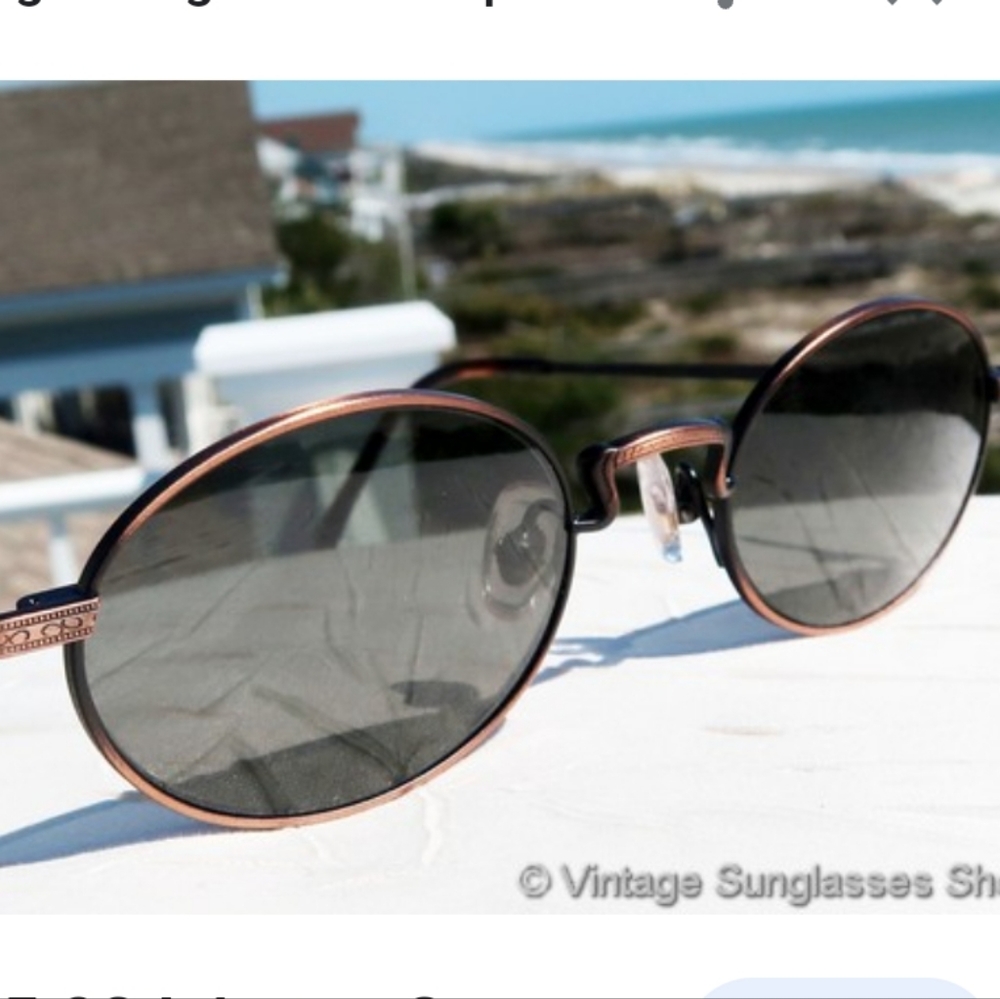 Revo Oval Copper Frame Sunglasses with Dark Gray Lenses
